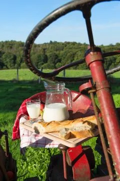 Tractor with milk and bread Stock Photos