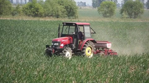 Tractor moving along a field (tracking shot) Stock Footage 51370407