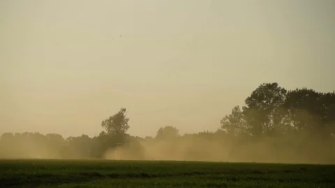 Tractor Moving Bales Of Hay Cut At Sunset Stock Footage 80477771