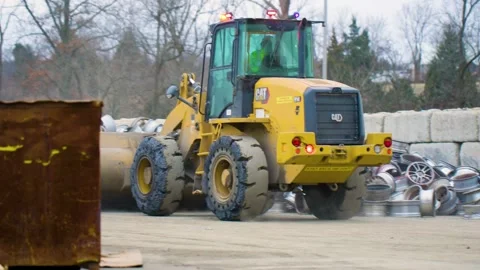 Tractor Moving Scrap Metal Stock Footage 238858776