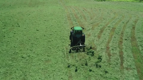 Tractor mowing grass aerials Stock Footage 76400827