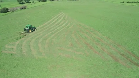Tractor mowing grass aerials Stock Footage 76402220