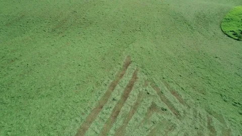 Tractor mowing grass aerials Stock Footage 76406370