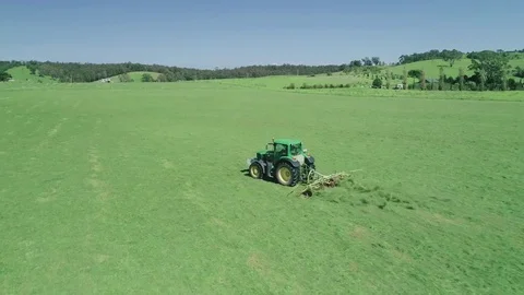 Tractor mowing grass aerials Stock Footage 76415603