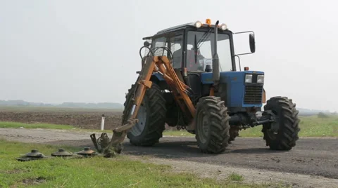Tractor mowing grass Stock Footage 65581509