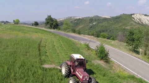 Tractor mows the grass on the mountains1.mp4 Stock Footage 42691987
