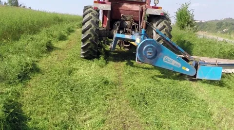 Tractor mows the grass on the mountains2.mp4 Stock Footage 42692474