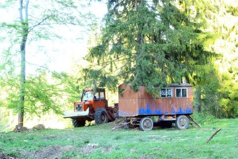 Tractor next to devastated forest Stock Photos