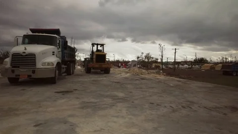 Tractor Parked Amid Hurricane Dorian Damage, High Rock, Grand Bahama Stock Footage 125960509