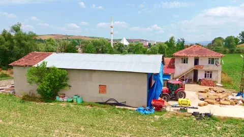 Tractor parked in front a house with. Stock Footage 284678815