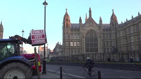 Tractor parked outside Parliament protests ahead of Budget announcement Stock Footage 321801152