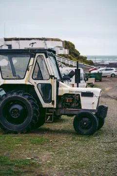 Tractor parked on weekend at the seaside Stock Photos
