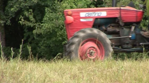 Tractor passes close and long shot Stock Footage 1070291