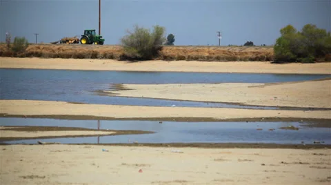 Tractor Passes Lakebed Stock Footage 38113657