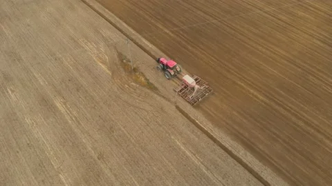 Tractor passes under power line Stock Footage 147348057
