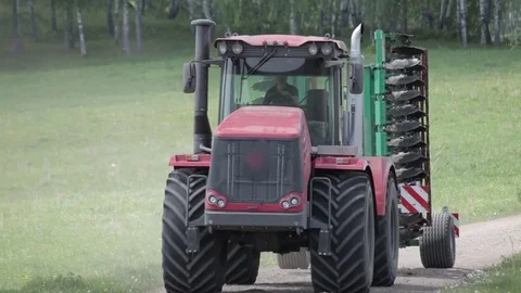 Tractor passing on countryside road Video stock 78673271