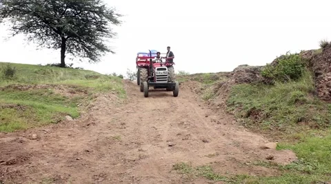 Tractor Passing through the village Stock-Footage 55444672
