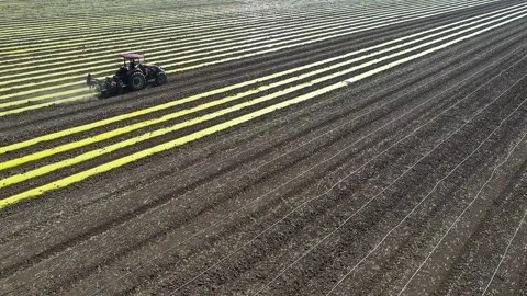 Tractor places plastic strips in the field Stock Footage 169342453