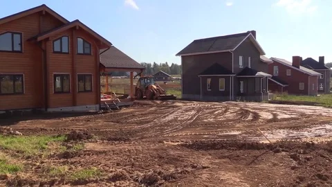 Tractor plan and align ground new building country house plot Stock Footage 80820447