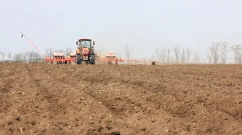 Tractor with planter approaches Stock Footage 62373914