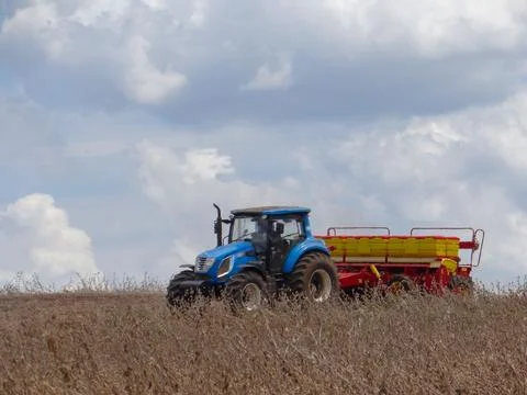 Tractor planter in full operation Stock Photos