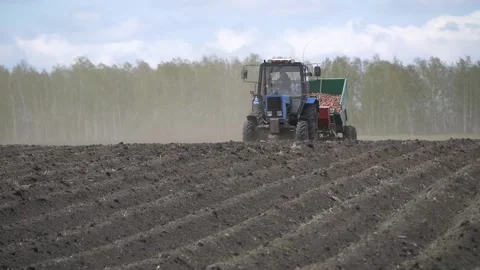 Tractor at planting work in the field. Stock Footage 197549713