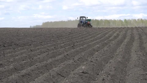 Tractor at planting work in the field. Stock Footage 197549724