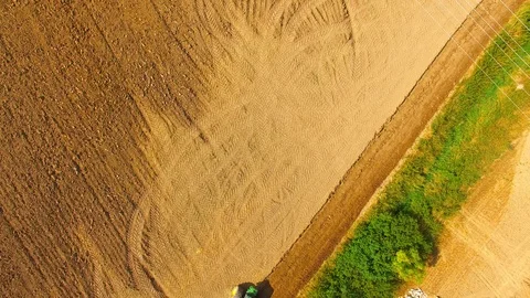 Tractor with plough working on a field. Stock Footage 95757981