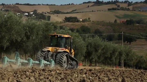 Tractor Ploughing downhill Stock Footage 94543178