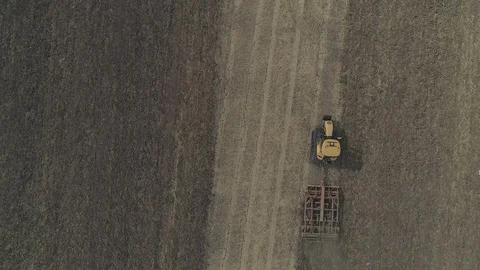 Tractor Ploughing Field Birds Using a Drone Video stock 93151319