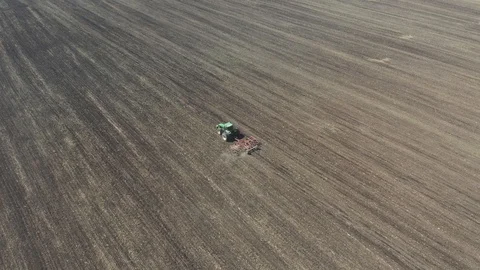 Tractor ploughing a Field in Early Spring Video stock 128073087