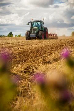 Tractor ploughing a field Stock Photos