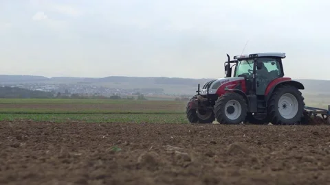Tractor is ploughing Stock Footage 146225486