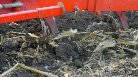 Tractor ploughing ground of agro field at spring Stock Footage 75436600