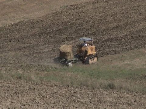 Tractor with plow and hay Video stock 41612977