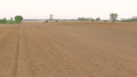 Tractor Plow Flyover 1 Stock Footage 83331519