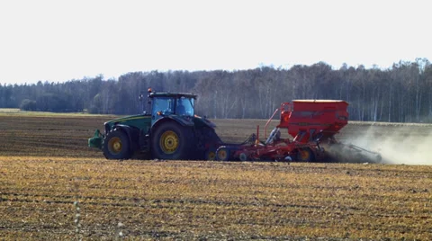 Tractor in plowed field Stock Footage 37624274