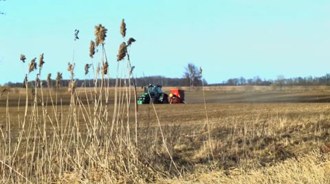 Tractor in plowed field Stock Footage 37624278