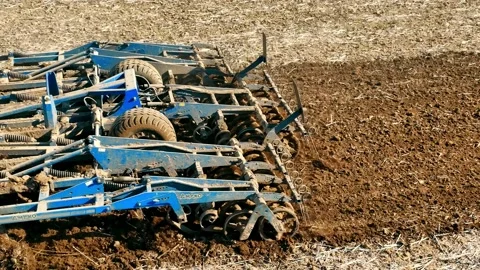 A Tractor Plowed A Field With A Plow Close-up In The Spring. Beginning Of Field Video stock 234783614