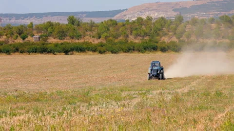 Tractor plowed wheat field Stock Footage 1396880