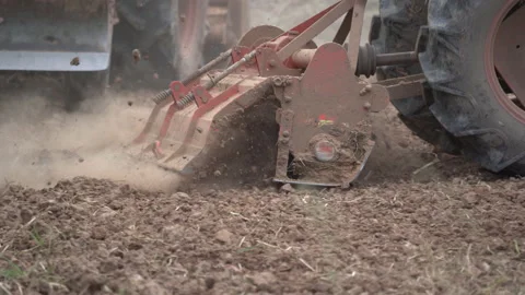 Tractor plowing and working prepare soil land for plantation in farm Stock Footage 136193281