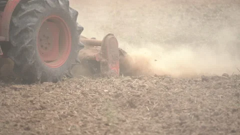 Tractor plowing and working prepare soil land for plantation in farm Vídeos de archivo 136193501