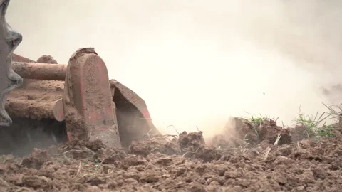 Tractor plowing and working prepare soil land for plantation in farm Stock Footage 136908747