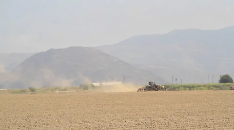 Tractor plowing dry field 2 Stock Footage 58935856