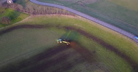 Tractor plowing farmland Stock Footage 83614849