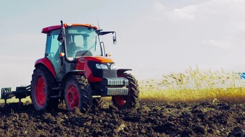 Tractor plowing the field 4K Stock Footage 127977150