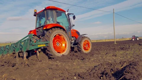 Tractor plowing the field 4K Stock Footage 127977504