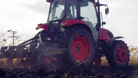 Tractor plowing the field 4K Stock Footage 127977849
