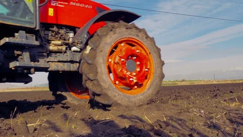 Tractor plowing the field 4K Stock Footage 127978077