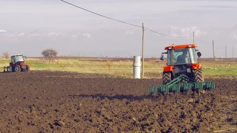 Tractor plowing the field 4K Stock Footage 127978227